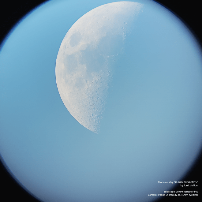 Supersized HD image of the moon in front of blue skies