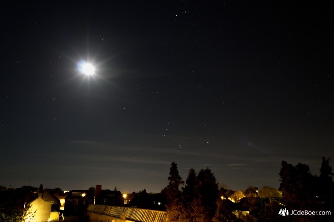 The Moon and the Orion constellation. Note the purple/pink glow in the middle of the 3 lowest stars; The Orion Nebula